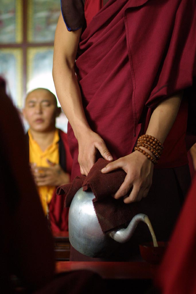 Buddhist monk serving Tea in Swayambunath (Nepal)