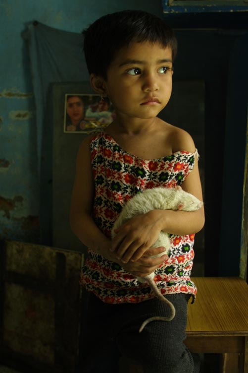 Little girl with pet rat